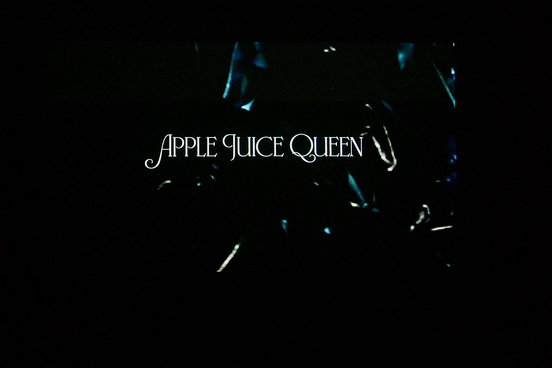 Title sequence of short film, light blue font on dark background.