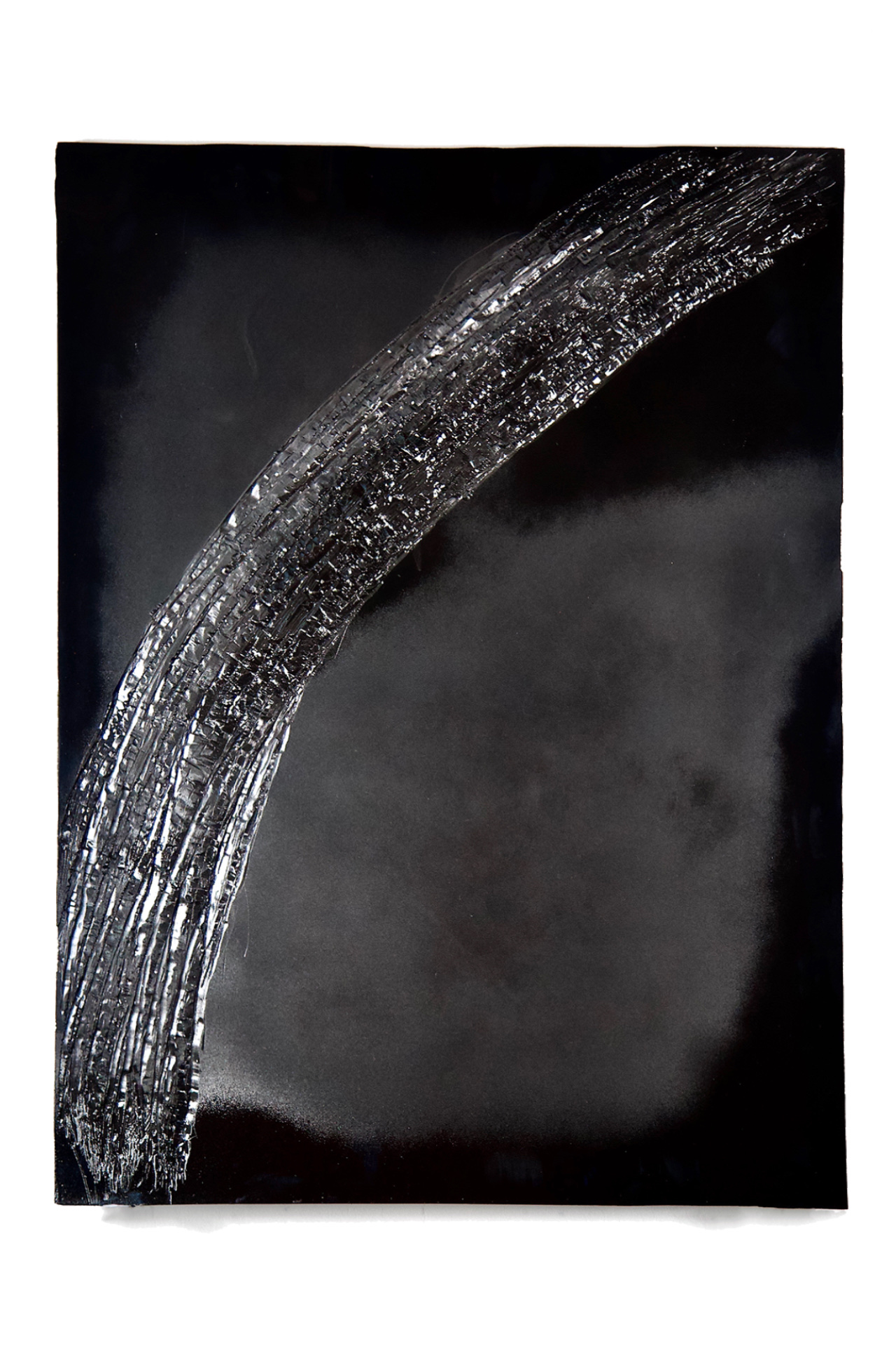 Black sculptural drawing with a roughly carved curve on the surface