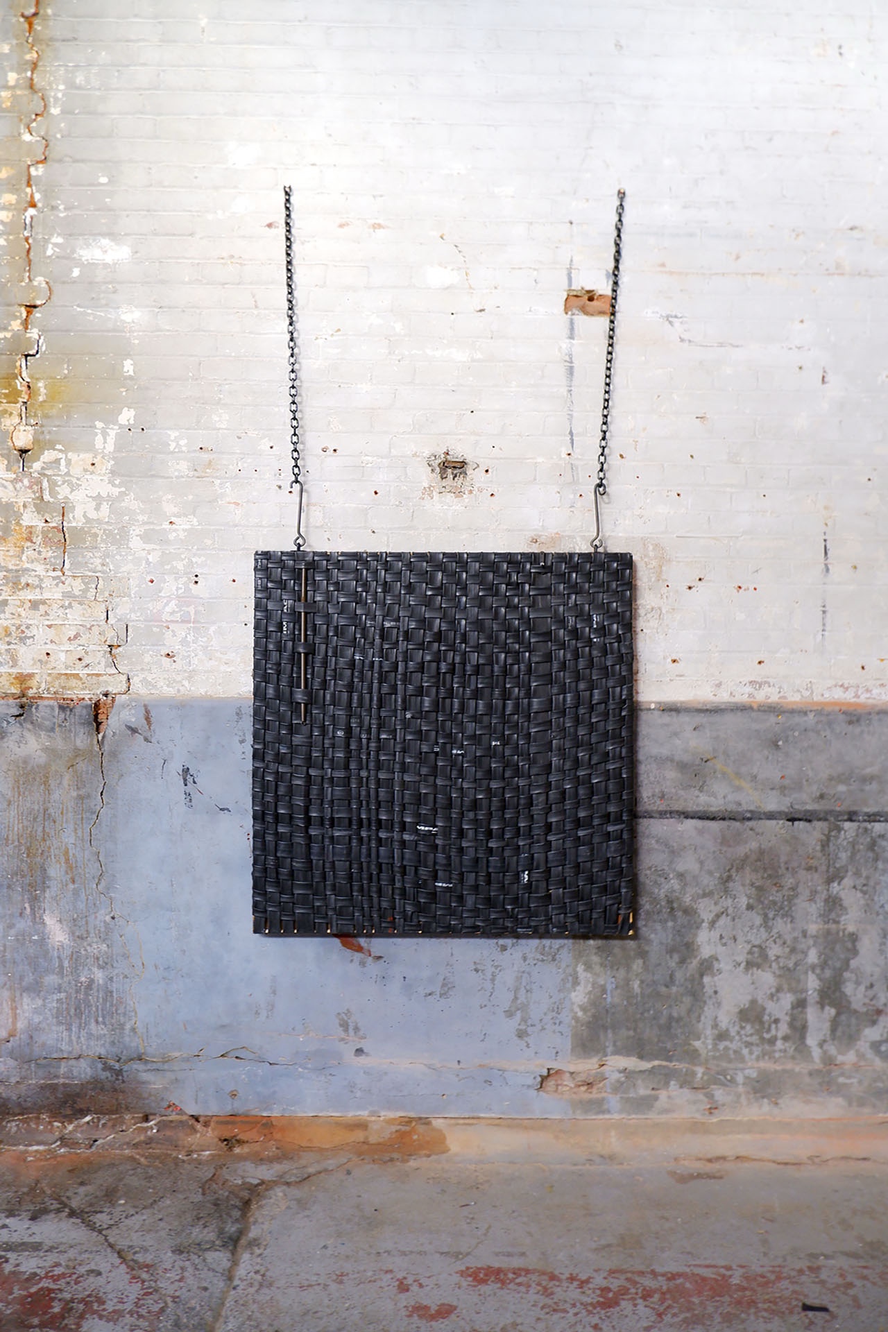 large scale weaved inner tube canvas containing stainless steel cable, inner tubes, timber frame, black titanium chain iron hooks