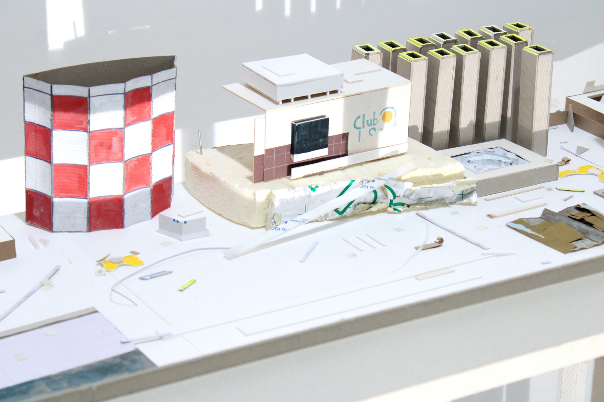 cardboard models of hotel and beach strip on table top 