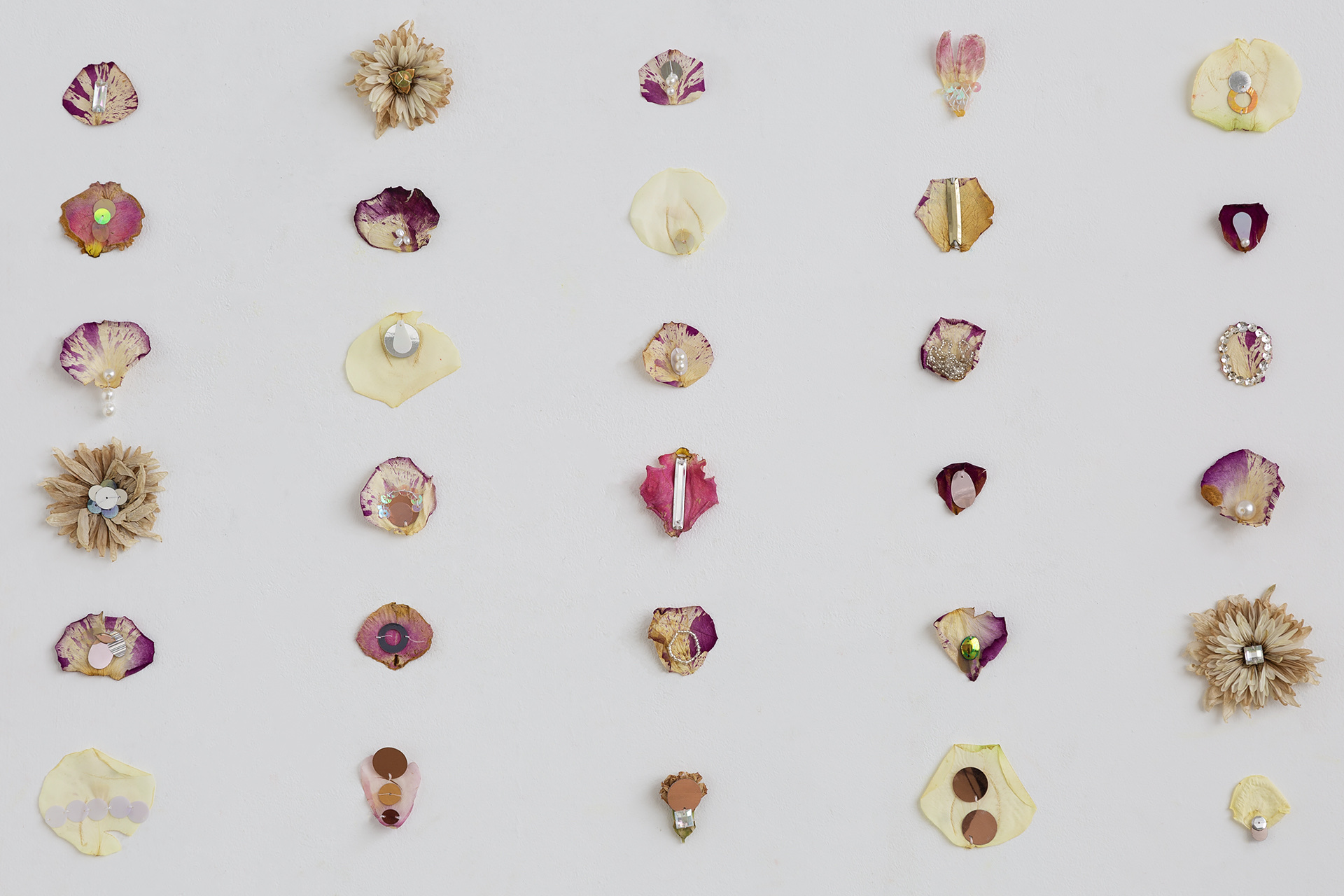 Image of bejewelled embroidered dry flower petals