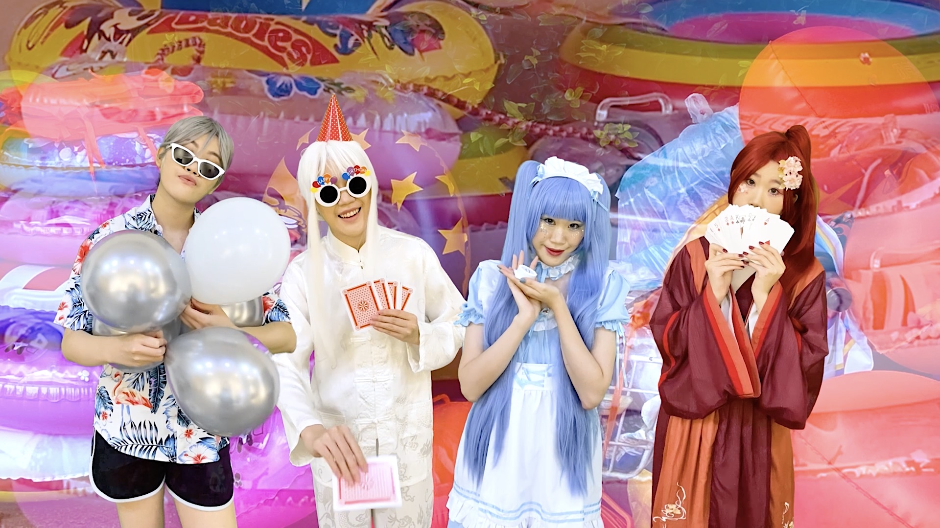 Four characters played by the artist stands in front of a wall of colorful swimming buoys, as they throw a birthday party.