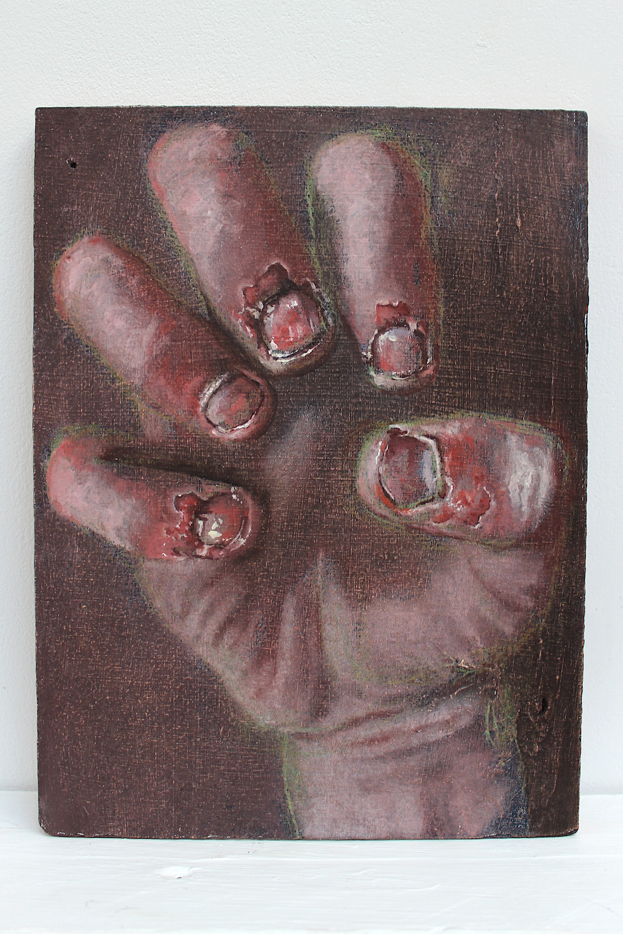 An image of a human hand with the fingers tensing, palm facing upwards. The focus in the painting is on the finger nails and it is evident that they have been bitten or wounded heavily with short and broken nails and loose bits of skin.