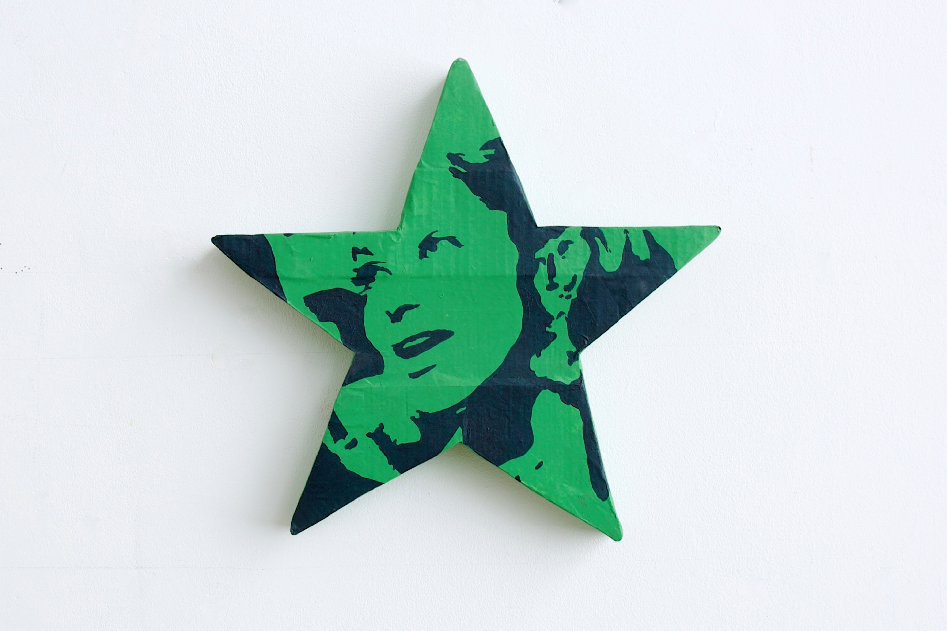 Bollywood actress Deepika Padukone is reduced to a two tone portrait on a painted paper-mache star. One of 7 stars from my hall of fame inspired series 'GOLDEN RULES' that depicts different famous Bollywood faces. 