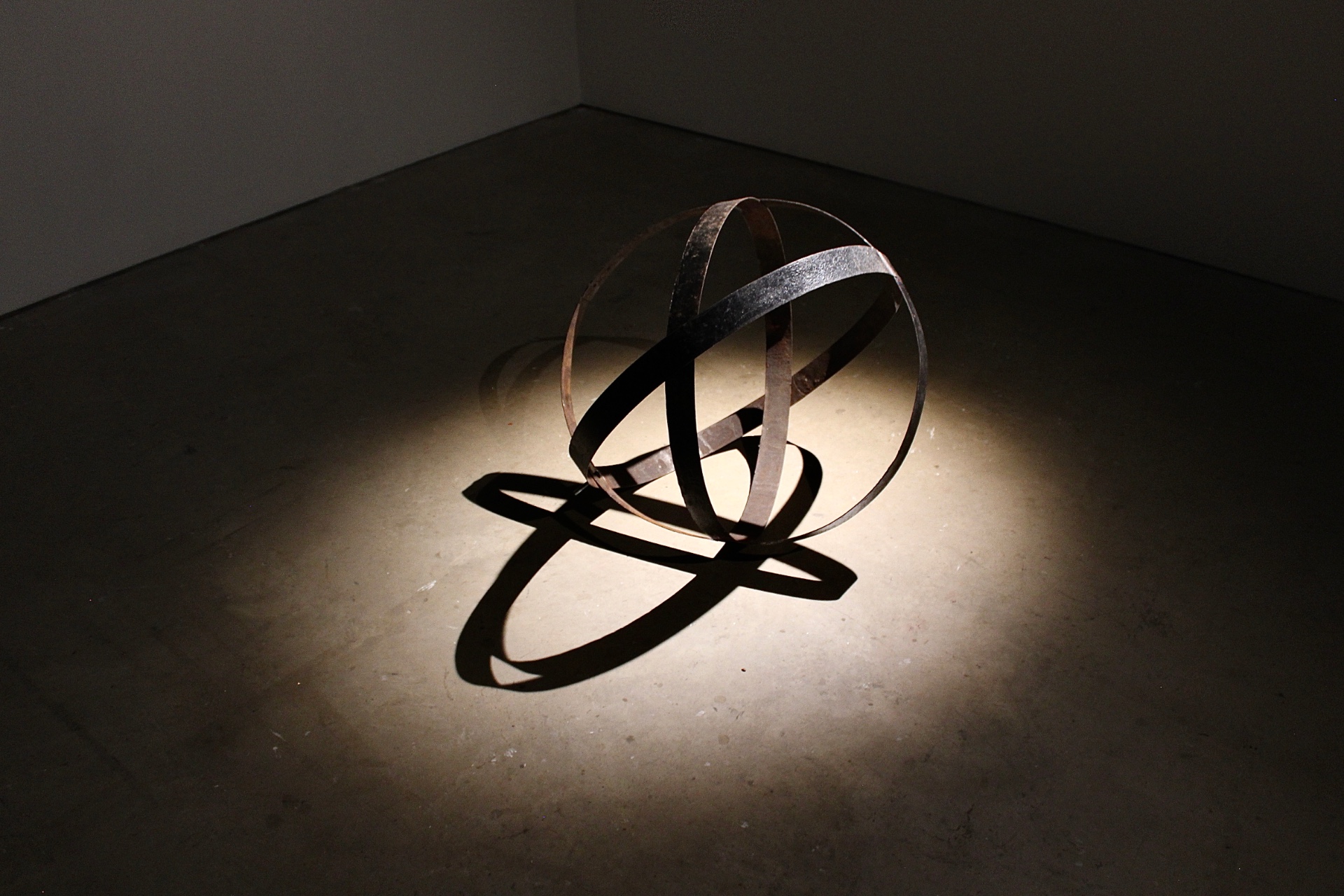 A metal sculpture of a celestial sphere.