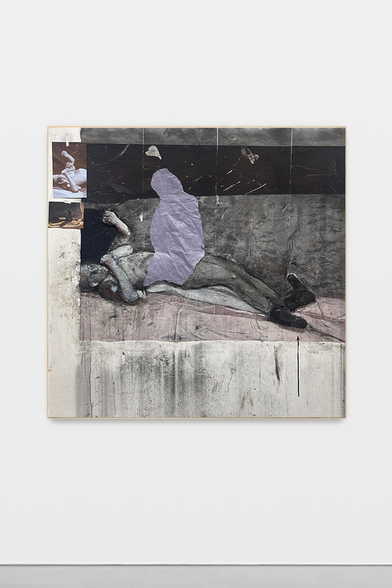 A painting with a three-dimensional protrusion in the shape of a pair of wrestlers. On the left side of the artwork are two photographs taped to the surface. There is a pink tissue cut out of a figure on the chest of one of the wrestlers. 