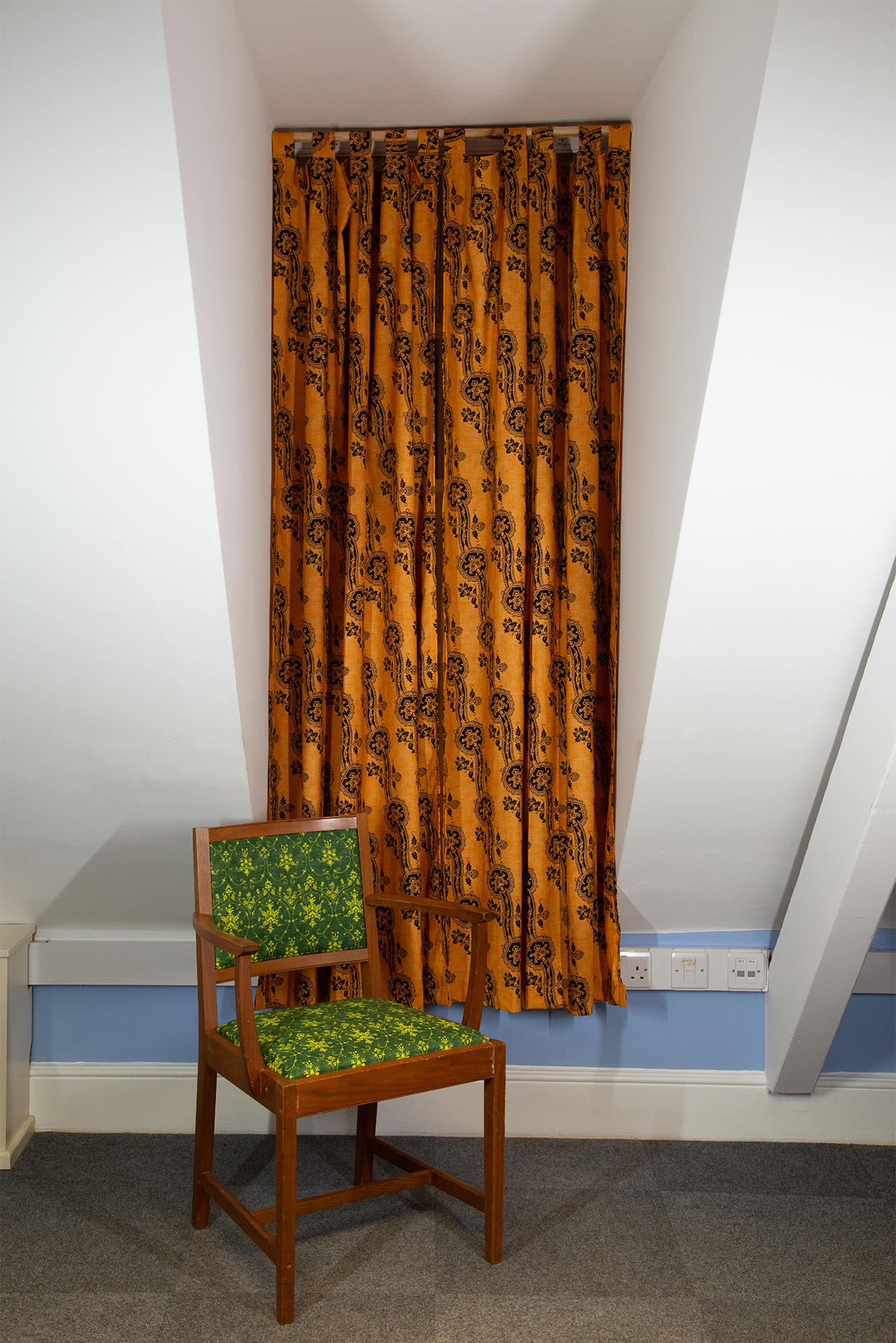 Curtains and office chairs reupholstered with screenprinted fabric.
