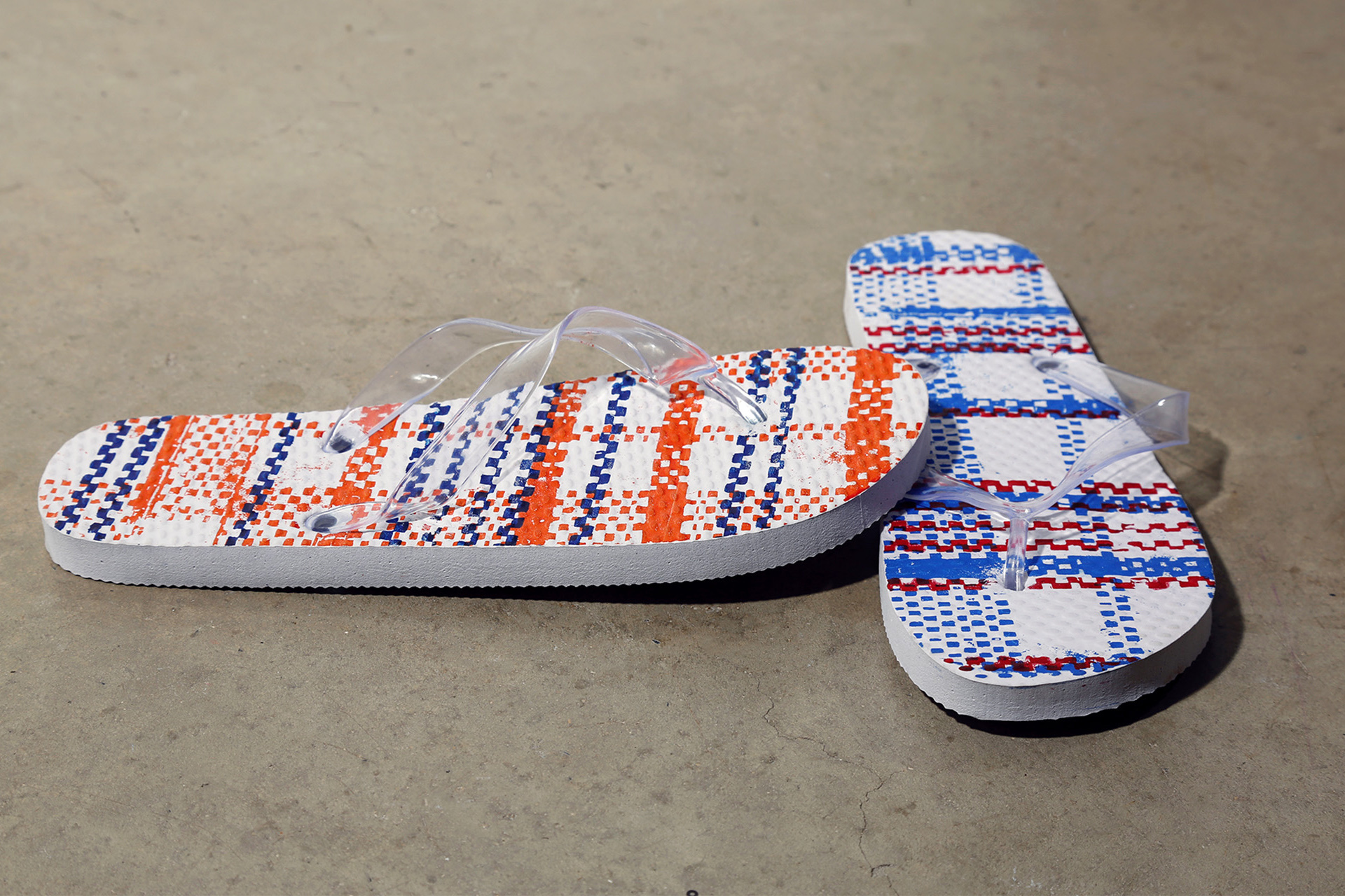 Image of patterned flip flops on the floor