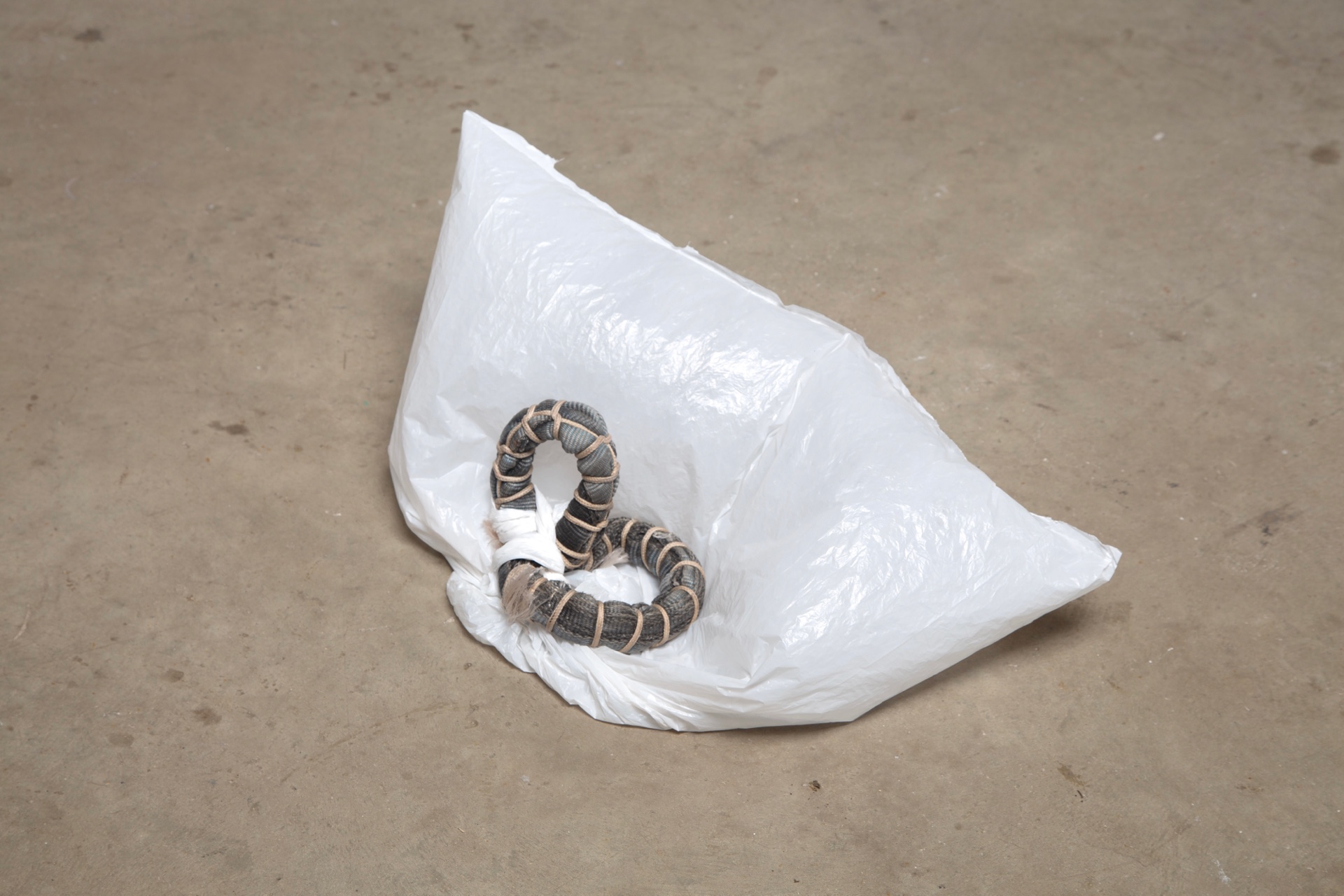 fabric yoke tied to plastic bag