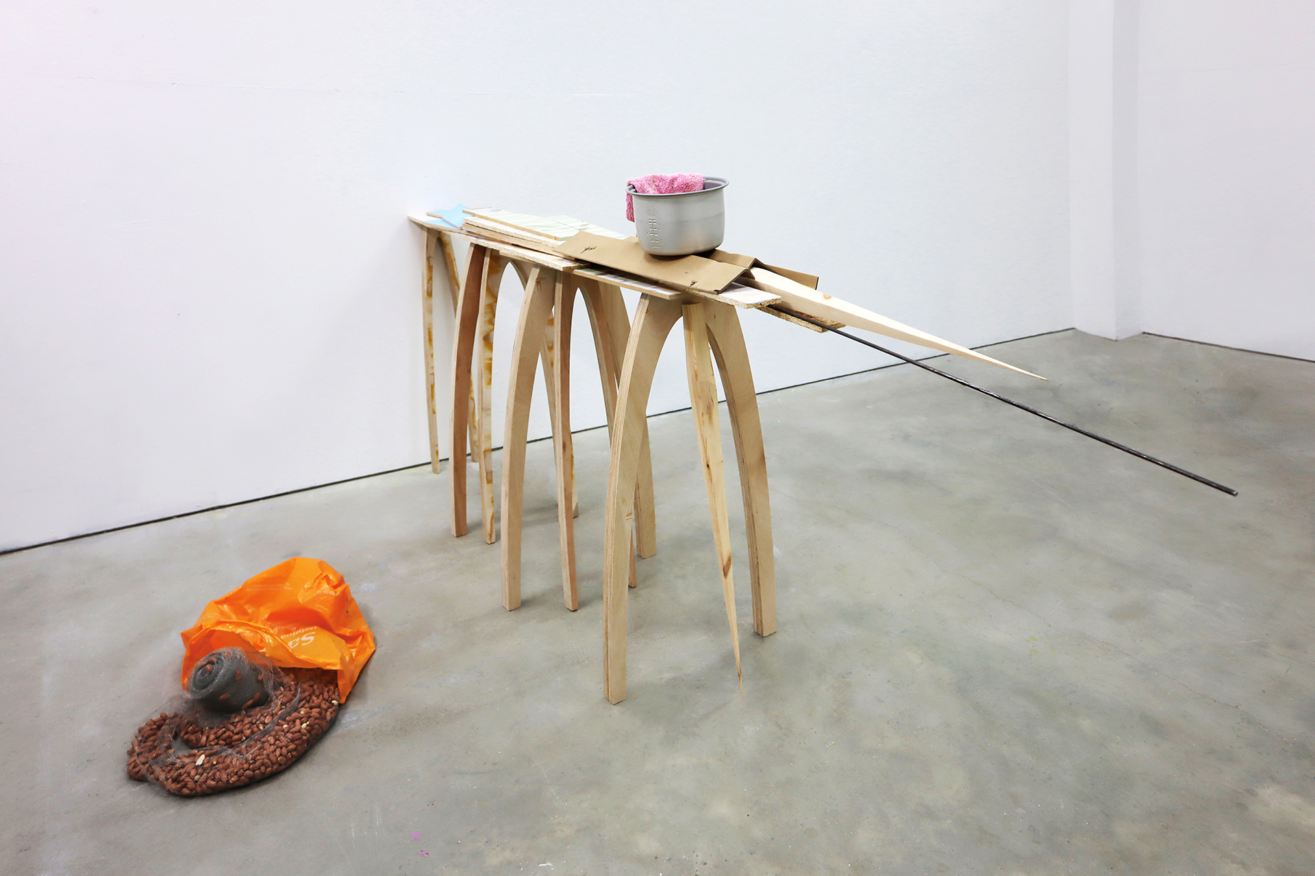 Towel, bowl, cardboard, plywood, timber, peanut, steel wool, plastic bag, variable installation.