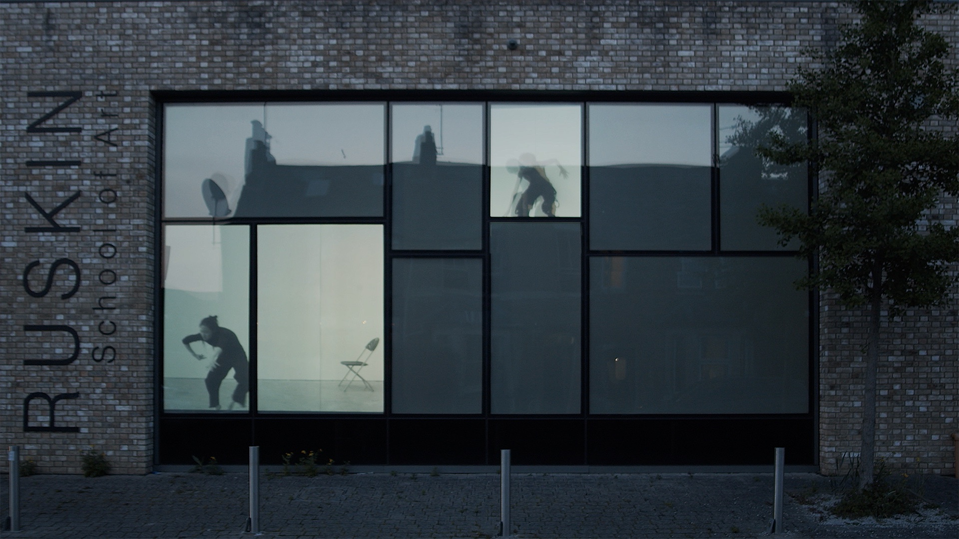 Split-screen film projected on the windows of the Ruskin's Bullingdon Road studio. Anonymous users move through each window, or 'chat-room', to find and doxx TOM, the digital pirate who has invaded their space. 